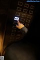 A person is pressing a button on an elevator.