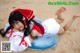 A woman laying on an inflatable ring on the beach.