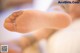 A close up of a person's foot with a bandage on it.