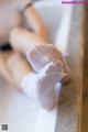 A close up of a person's feet in white socks.